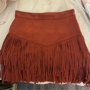 Fringe red/burnt orange skirt. Never worn. Tags taken off